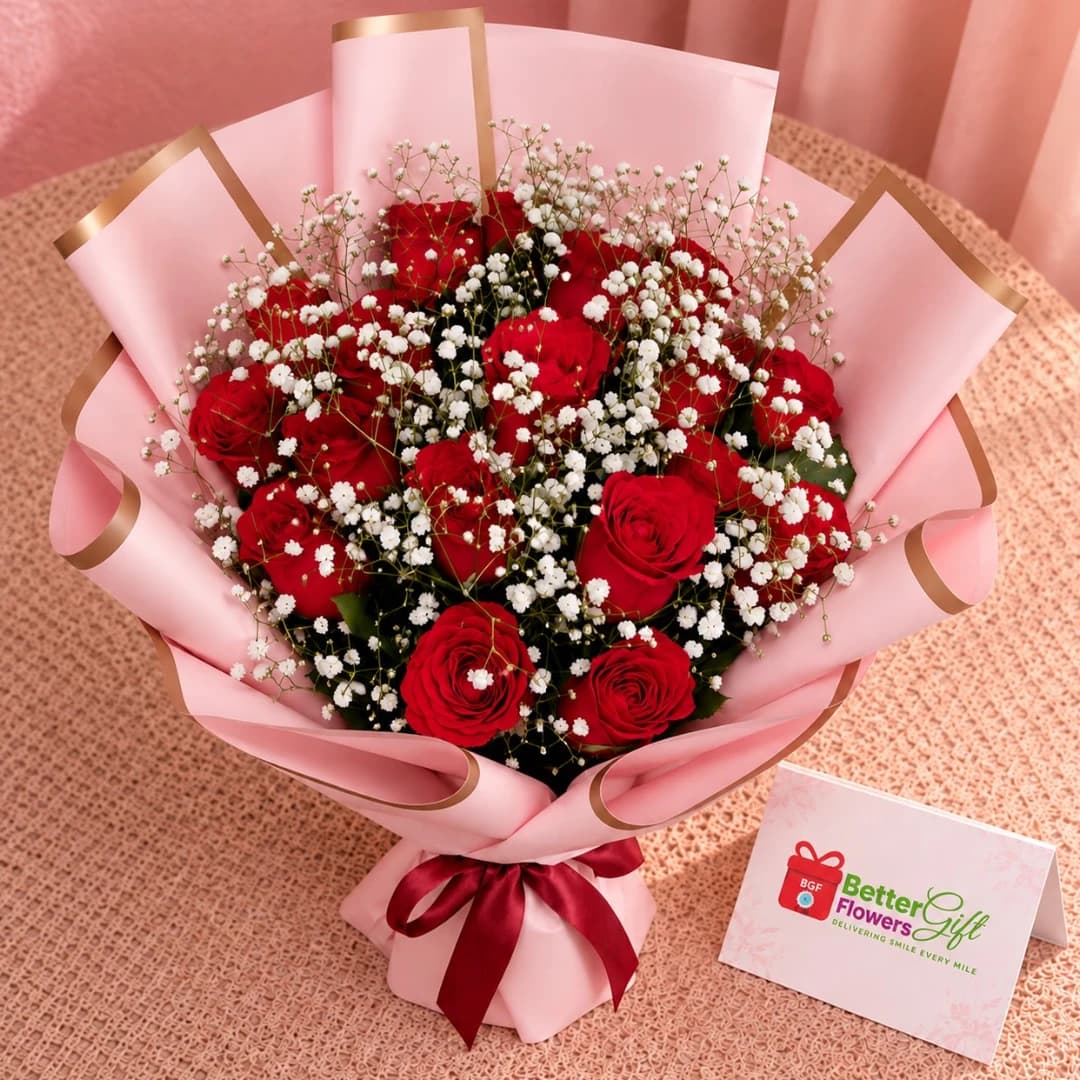 Close-up of red roses and white baby’s breath in a pink bouquet