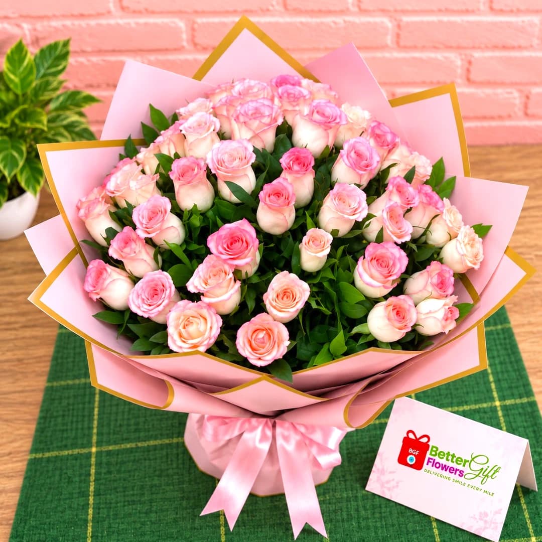 Close-up view of fresh pink roses arranged in a large bouquet
