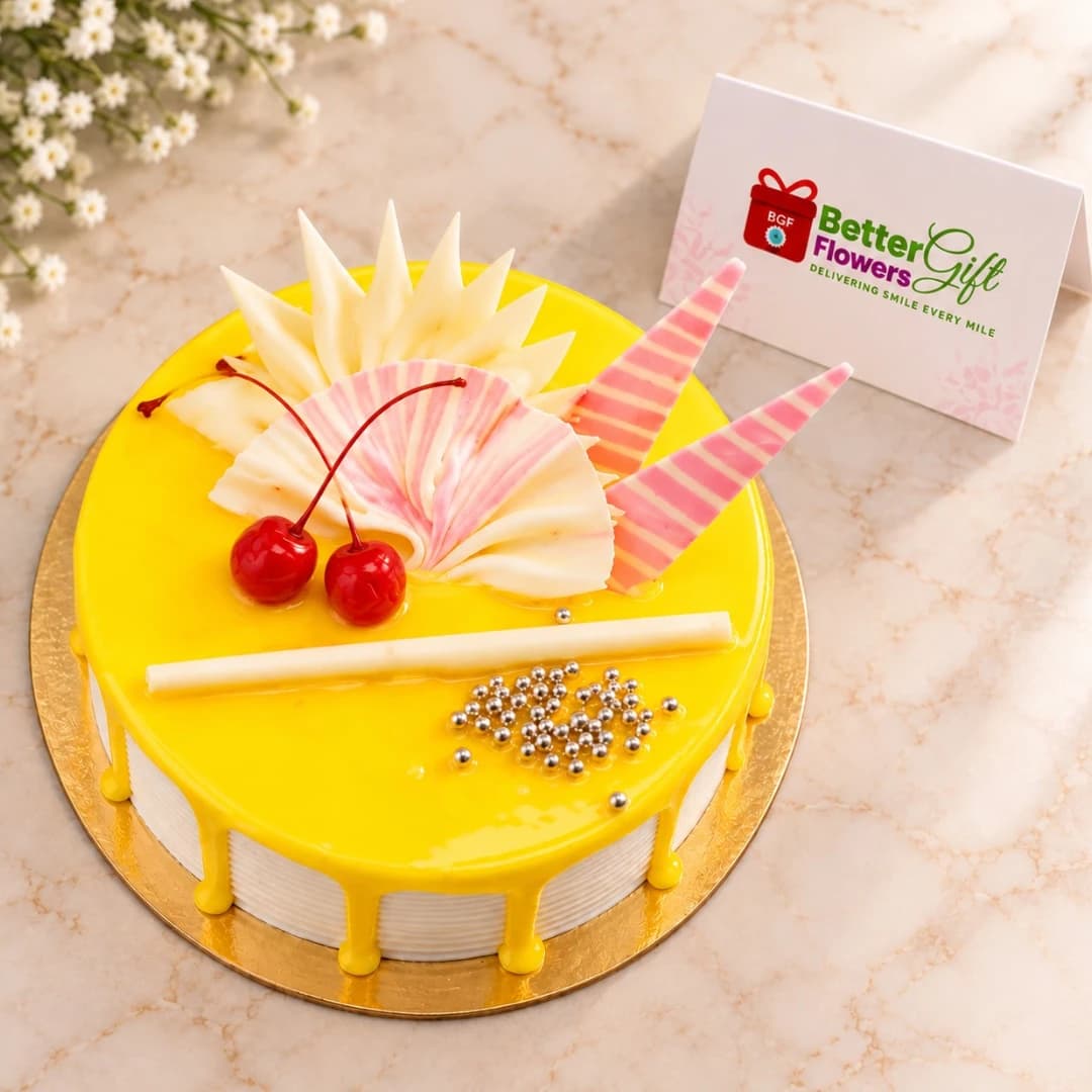 Pineapple flavour cake with yellow glaze, cherries and white chocolate decoration