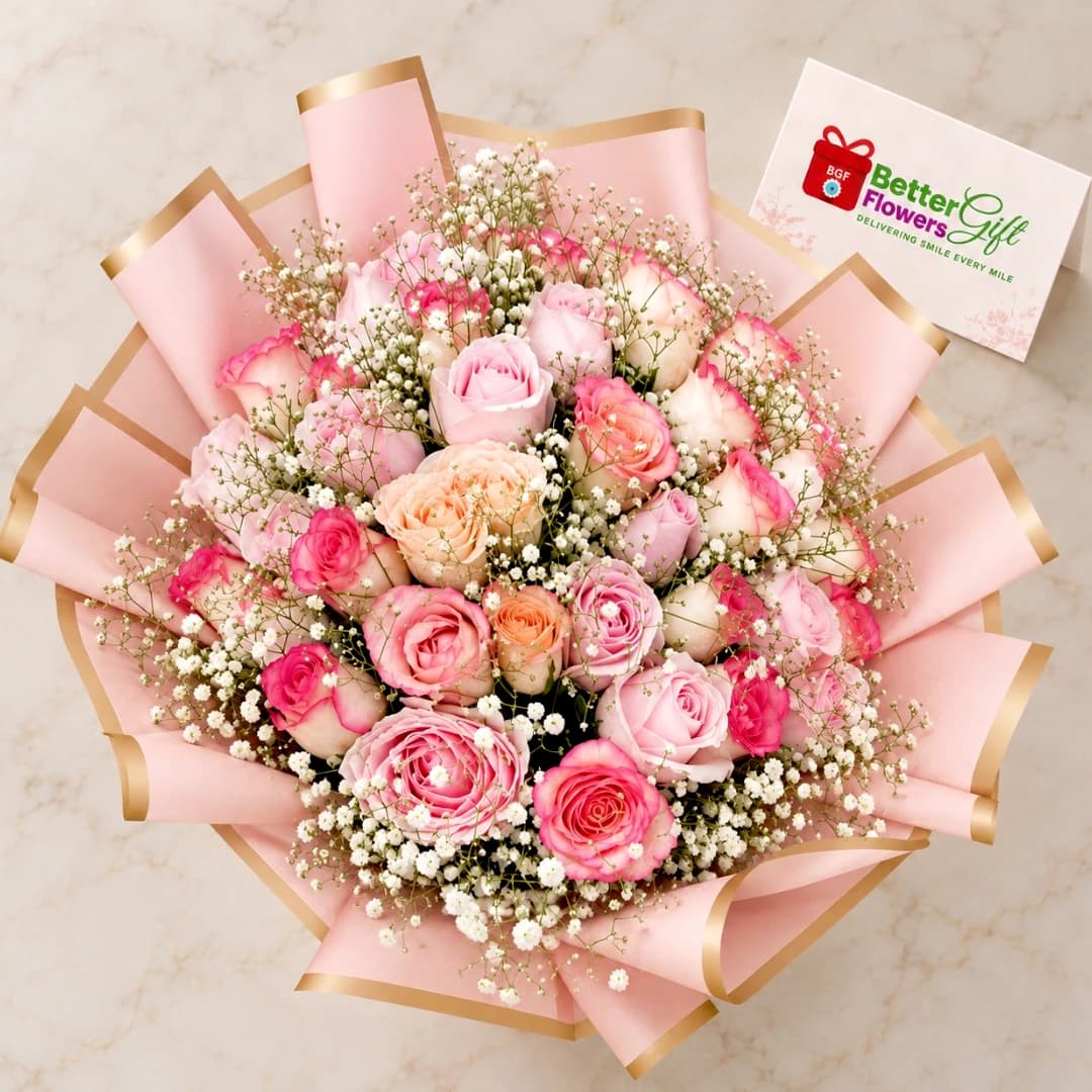 Close-up of a mixed pink rose bouquet featuring peach and cream roses with delicate white baby's breath.