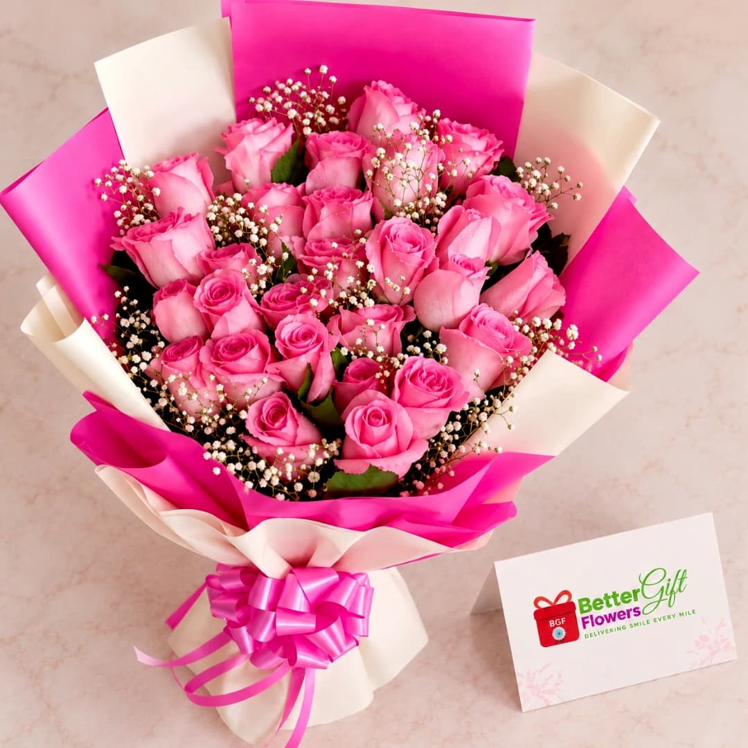 Close-up of pink roses and white baby's breath in an elegant pink and ivory wrapped bouquet