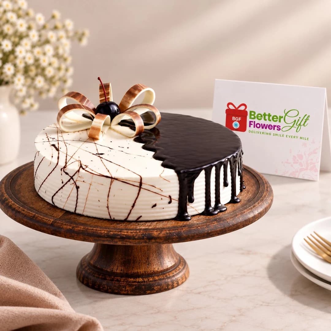 Half chocolate half vanilla cake with chocolate bow on wooden cake stand