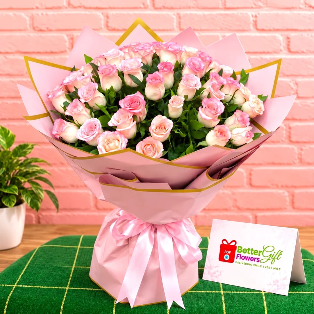 Pink and white rose bouquet with elegant pink wrapping and satin bow