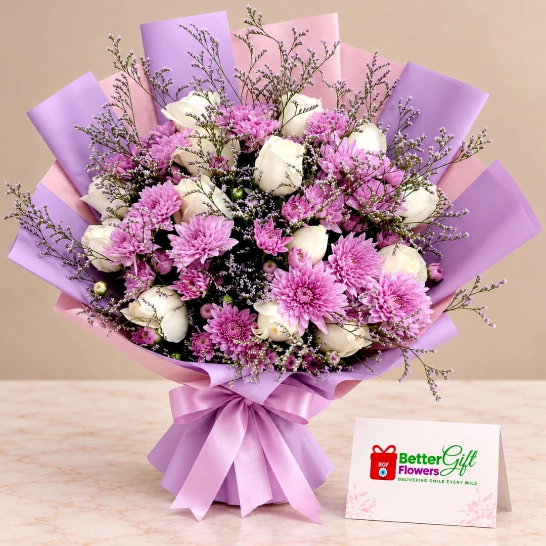 Purple chrysanthemum and white rose bouquet with delicate filler flowers, lavender and pink wrapping, and a satin ribbon.