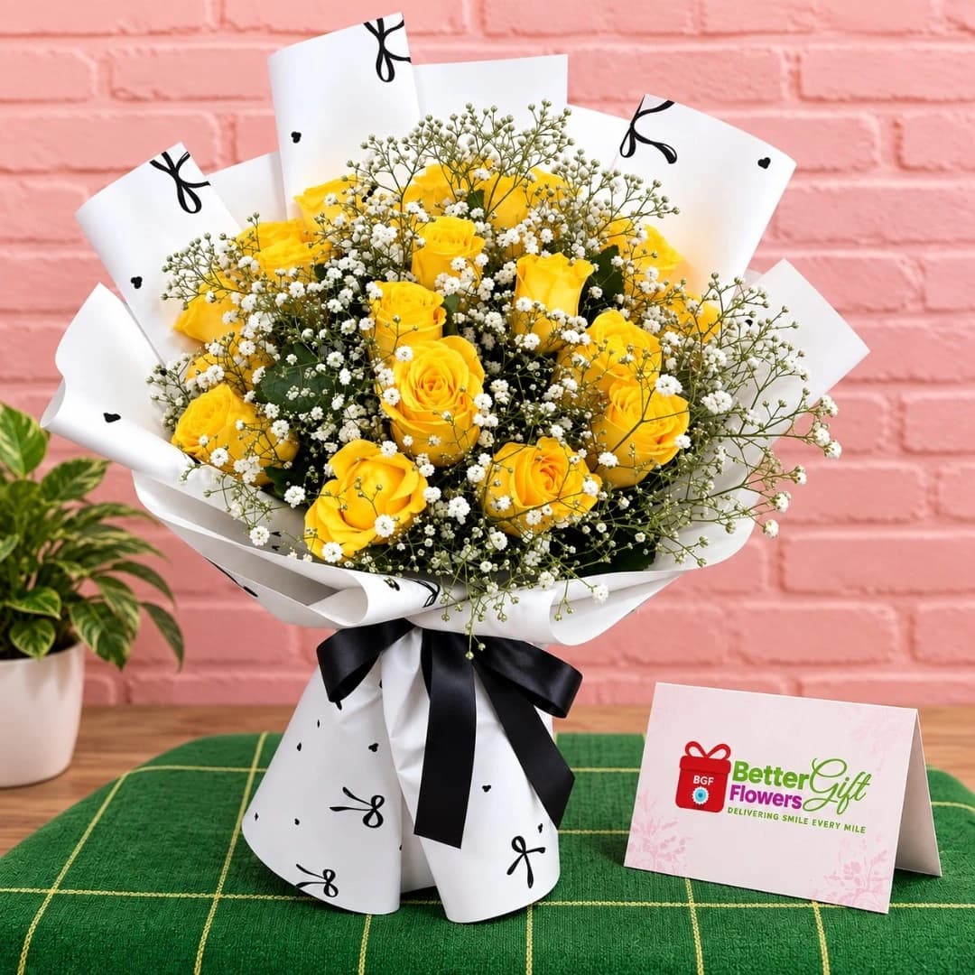 Yellow rose bouquet with baby’s breath and green foliage in white and black wrapping