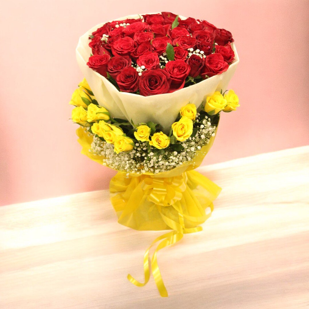 Beautifully arranged bouquet of red and yellow roses from BetterGiftFlowers