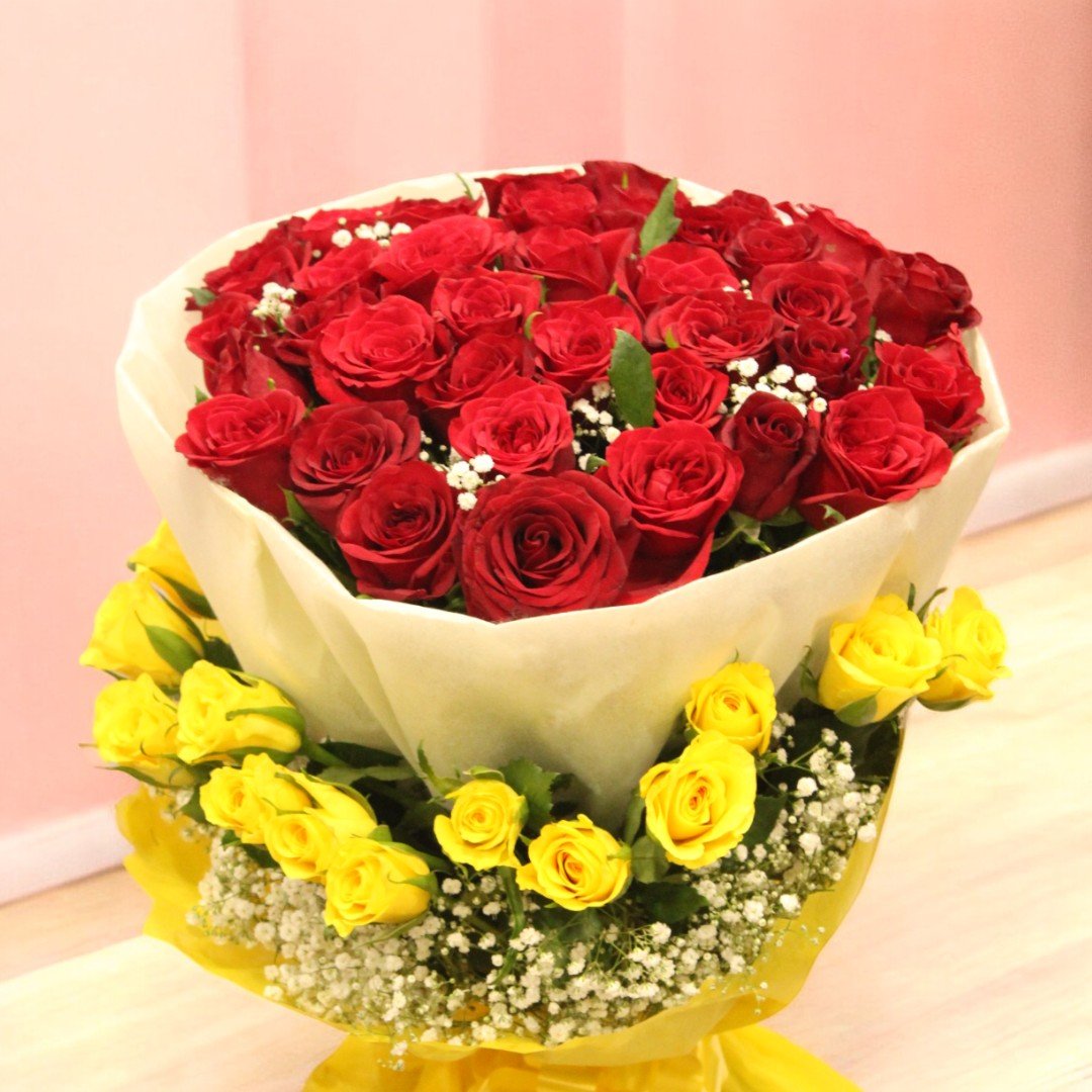Vibrant bouquet of red and yellow roses for gifting, crafted by BetterGiftFlowers