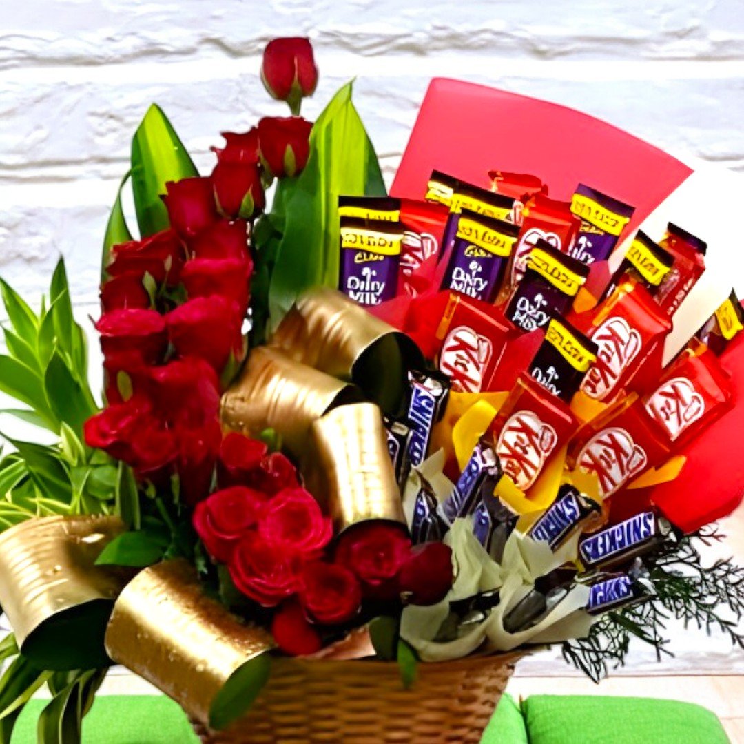 Beautifully arranged Special Gift Hamper by BetterGiftFlowers with red roses and an assortment of popular chocolates.