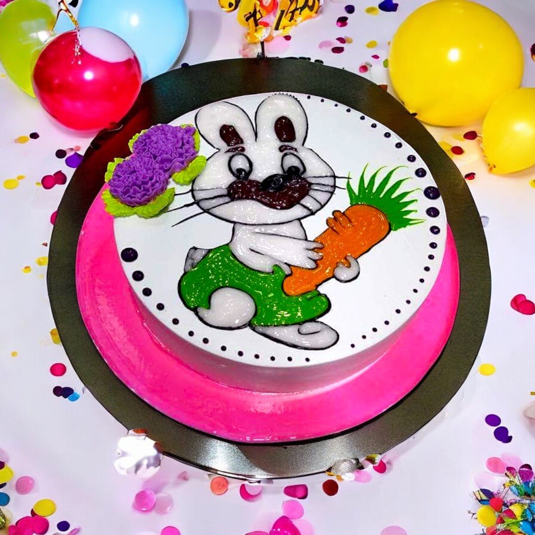 Bunny Cake by BetterGiftFlowers on display with festive background decorations.
