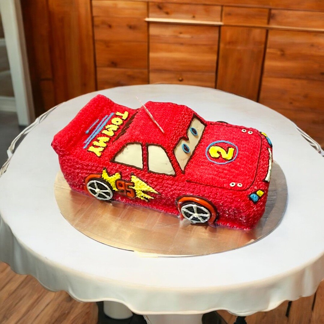 BetterGiftFlowers car-themed cake for kids, decorated in vibrant red with number 2.