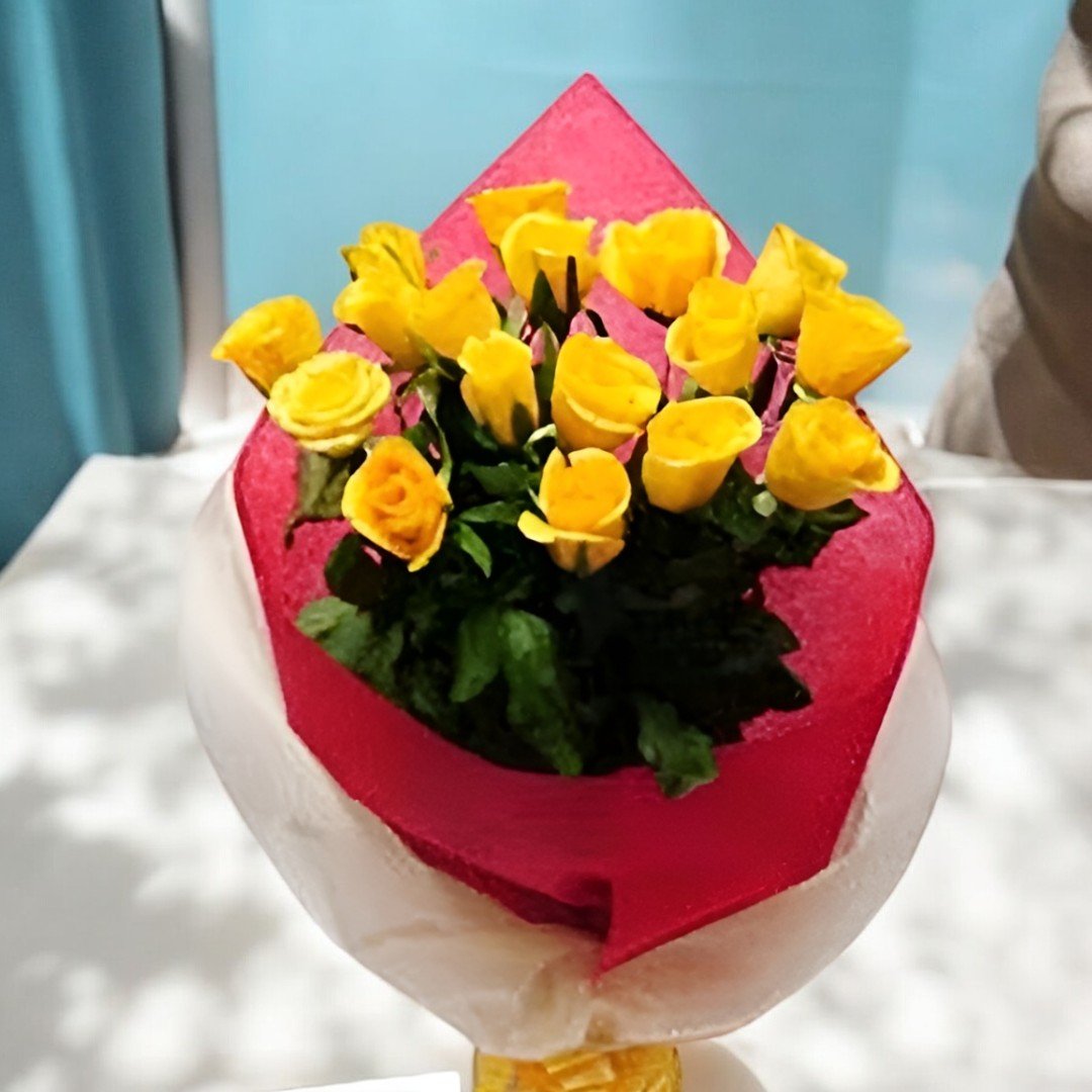 Close up of beautiful yellow roses wrapped in red paper by BetterGiftFlowers