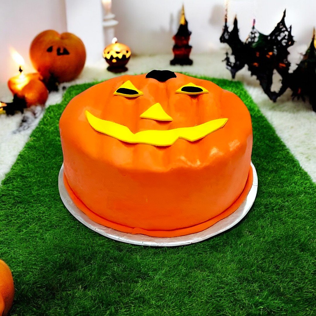 Halloween-themed Jack-o'-lantern cake with bright orange fondant, available at BetterGiftFlowers.