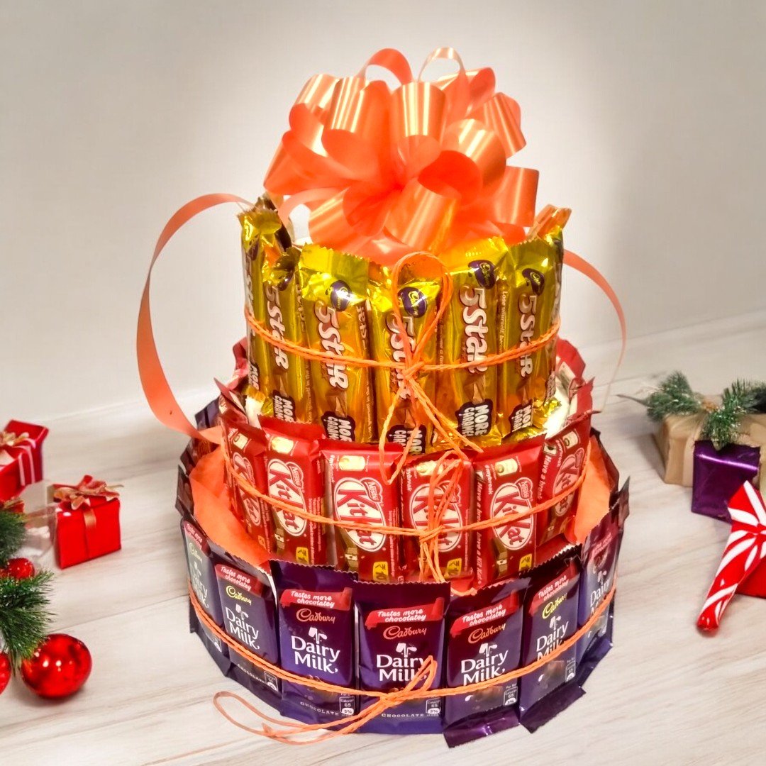 Beautifully crafted chocolate tower of Dairy Milk, KitKat, and 5 Star by Better Gift Flowers.