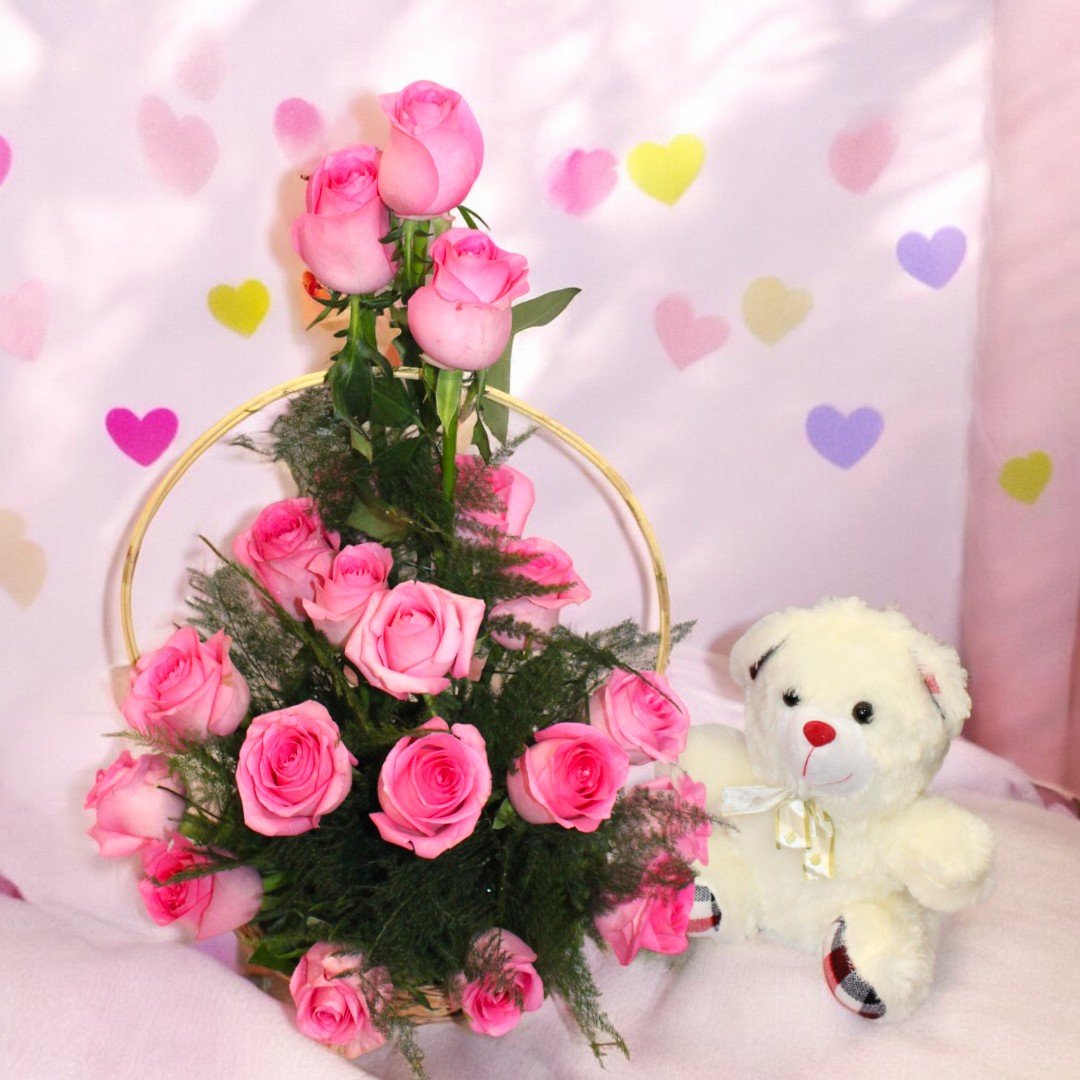 Beautiful pink roses basket paired with a teddy bear from BetterGiftFlowers, a delightful gift for any celebration.