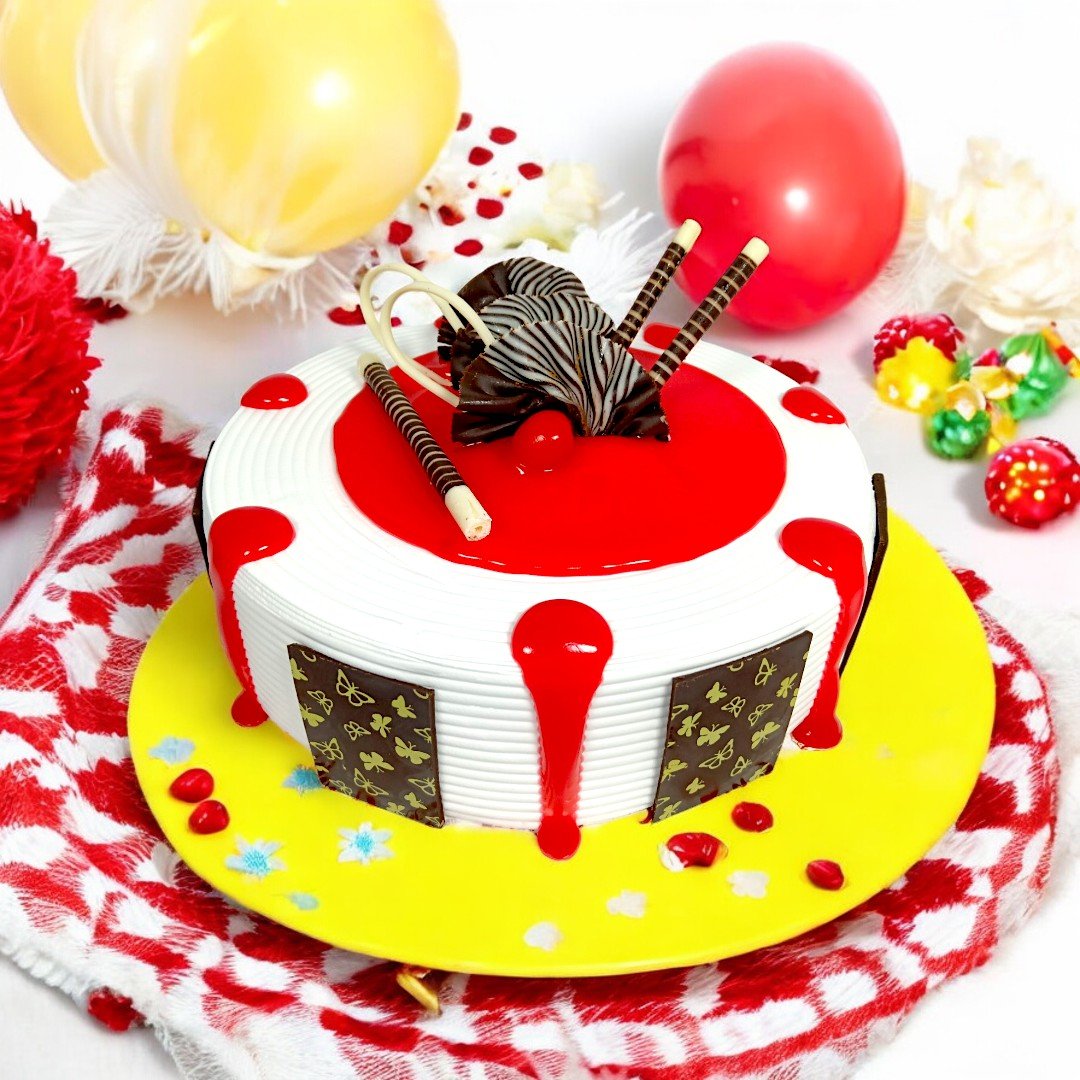 Festive Red Velvet Rhapsody Cake by BetterGiftFlowers with red glaze and chocolate art surrounded by balloons