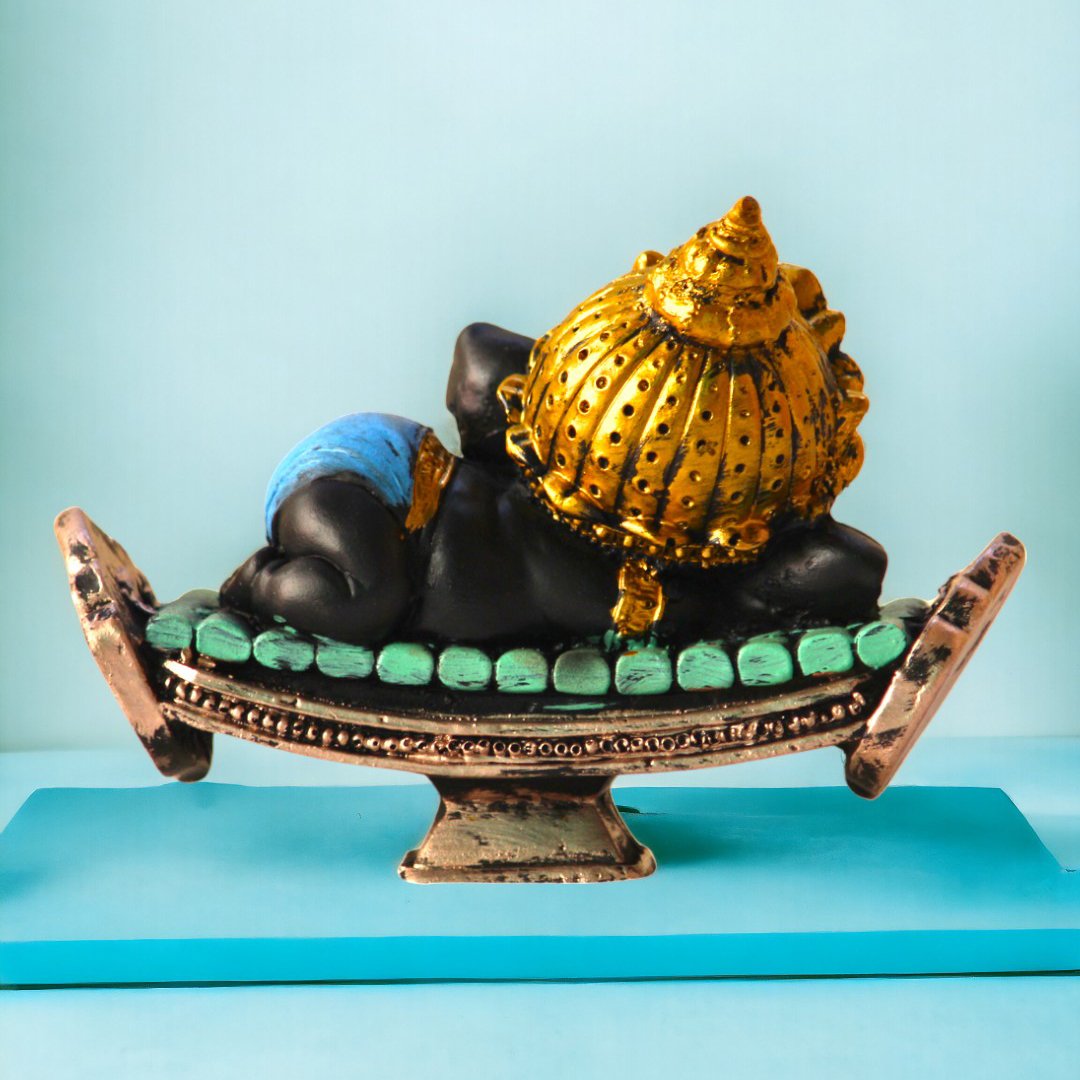Relaxing Ganesha Showpiece by BetterGiftFlowers with gold and blue details for home decor