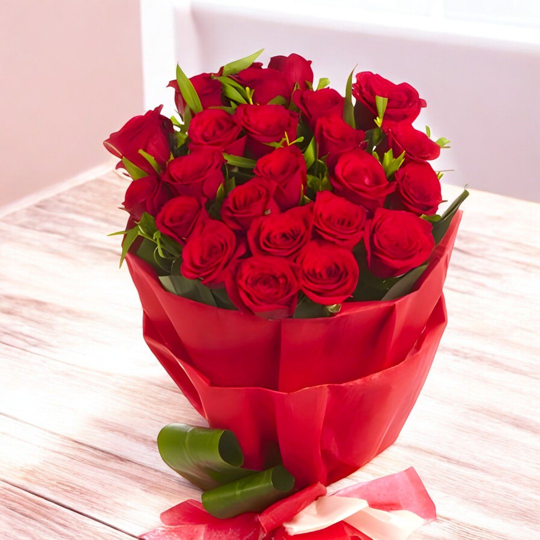 BetterGiftFlowers' romantic arrangement of 25 red roses wrapped in red paper.