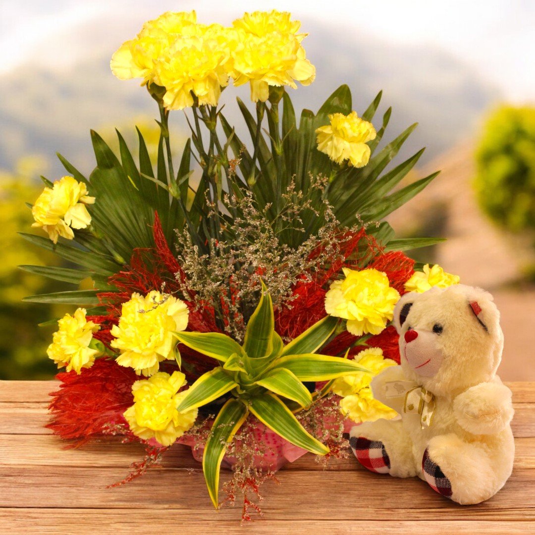 Fresh yellow carnations with cute teddy by Better Gift Flowers