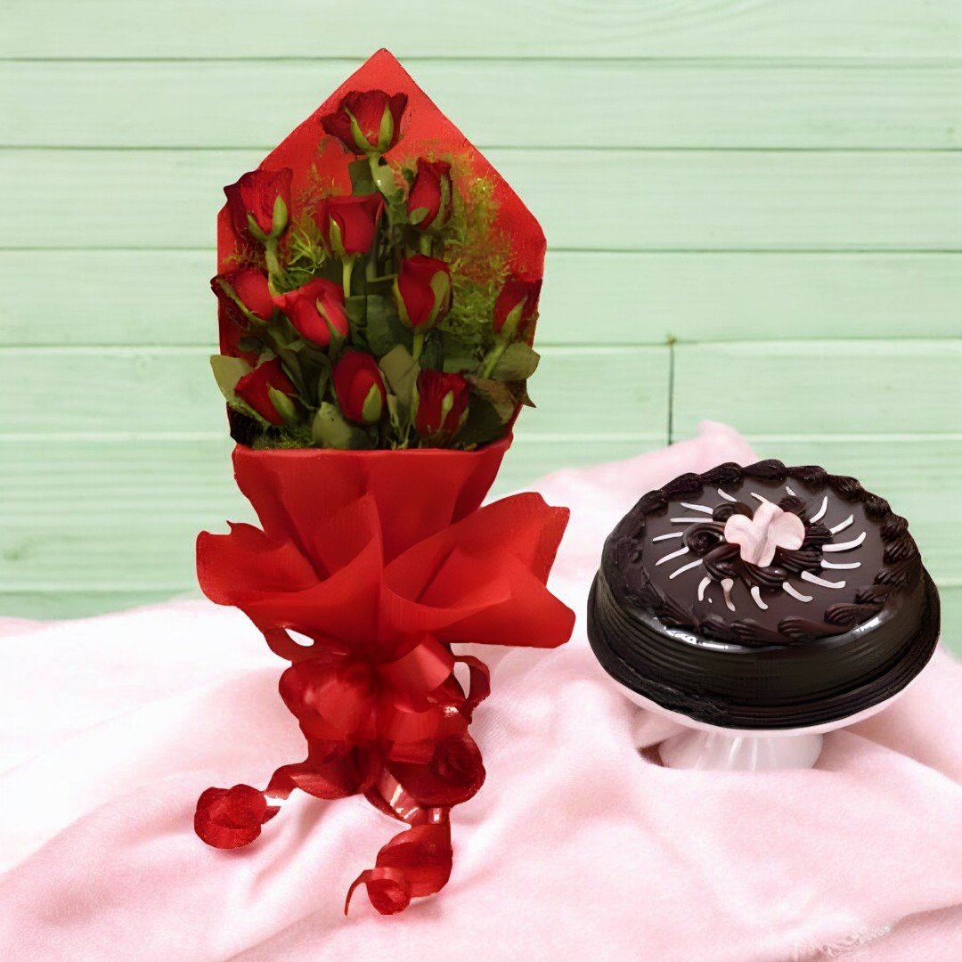 A bouquet of 12 red roses with a chocolate truffle cake from Better Gift Flowers