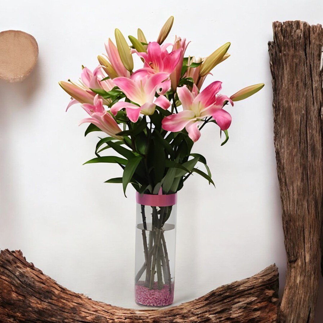 Beautiful pink Asiatic lilies bouquet in a glass vase by BetterGiftFlowers.