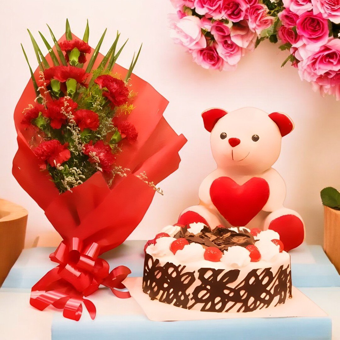 Classic Combo with red carnations bouquet, black forest cake, and teddy bear by BetterGiftFlowers