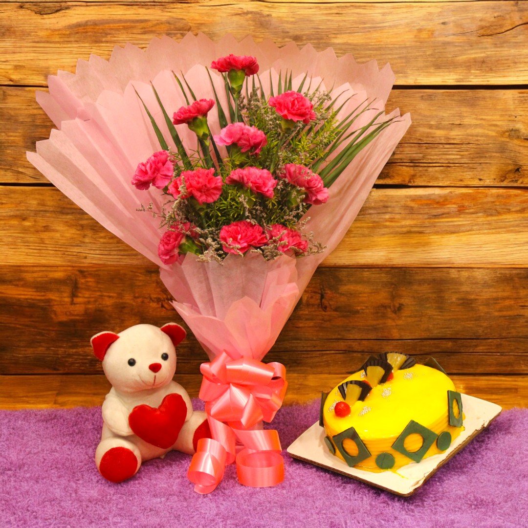 Color Me Pink Combo featuring pink carnations bouquet, teddy bear, and pineapple cake by BetterGiftFlowers.