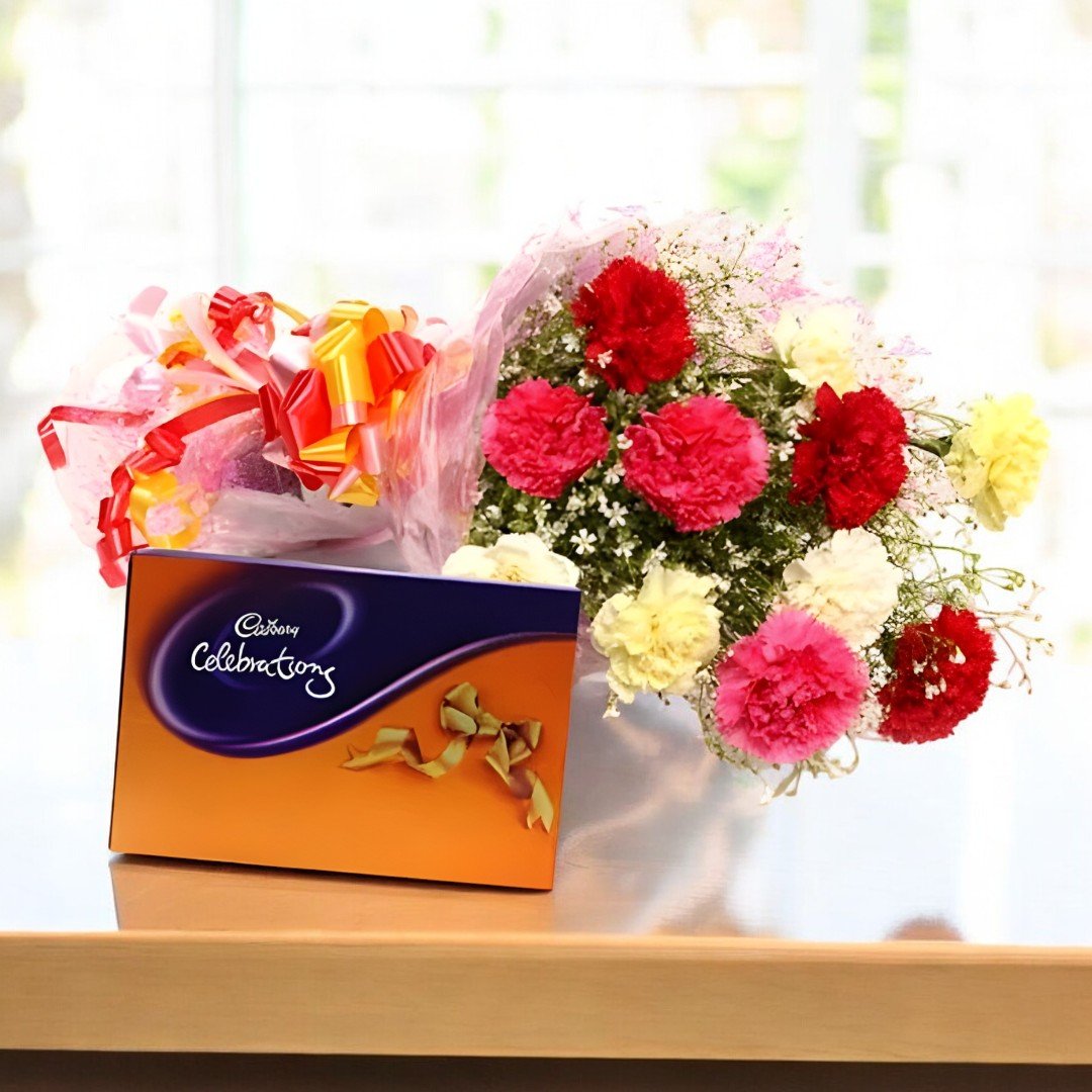 Colorful celebration mix carnations and Cadbury Celebrations chocolates beautifully arranged by BetterGiftFlowers.