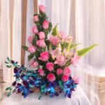 BetterGiftFlowers Enduring Memories basket with pink roses, lilies, and blue orchids beautifully arranged