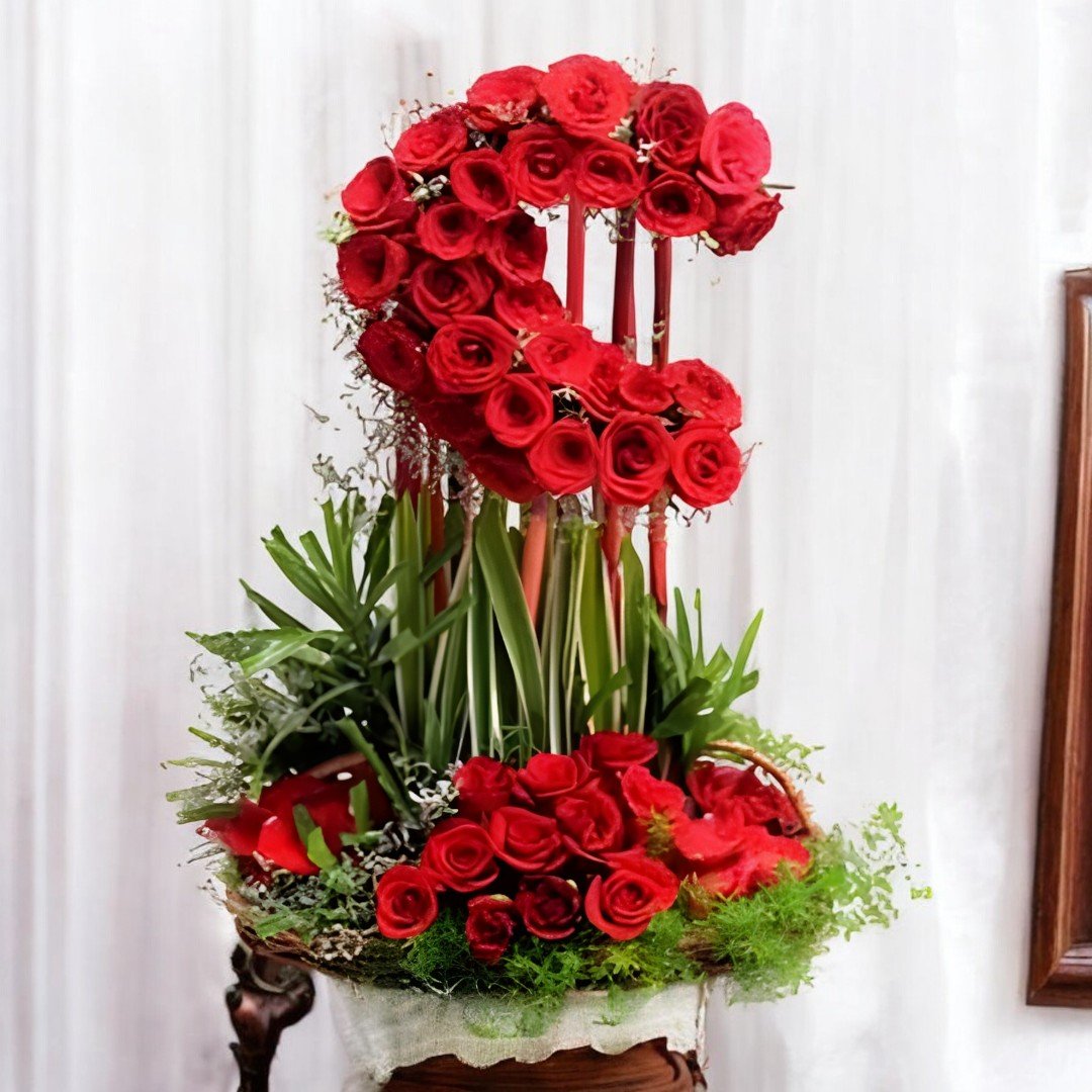 Beautifully shaped red rose arrangement by Better Gift Flowers in a 2 feet tall design for an elegant display of love.