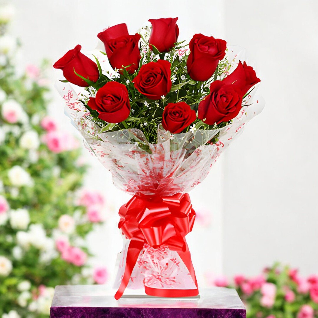 A beautifully wrapped bouquet of 10 red roses by BetterGiftFlowers, set against a floral garden backdrop.