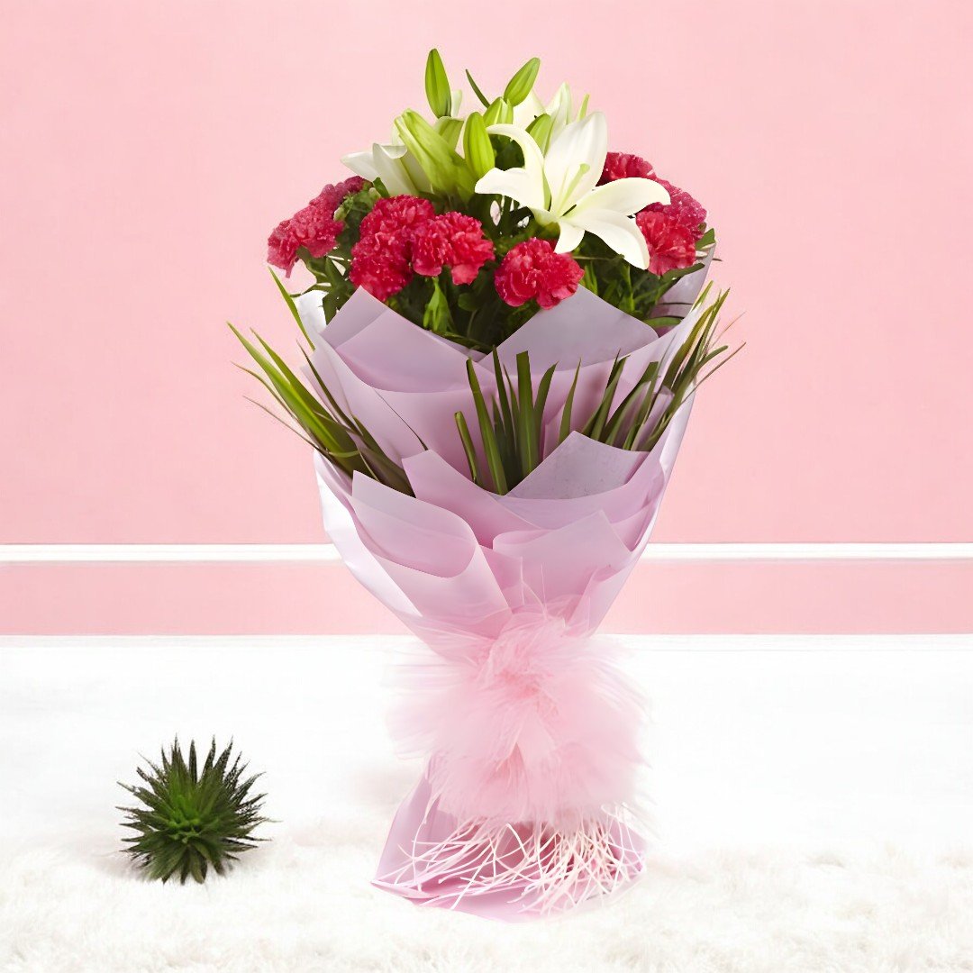 Express Yourself Bouquet with pink carnations and white lilies by BetterGiftFlowers in a pink wrapping.