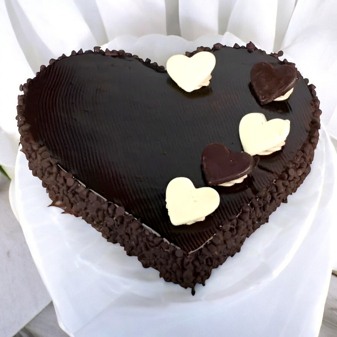 Heart-shaped chocolate truffle cake with white and dark chocolate hearts from BetterGiftFlowers.