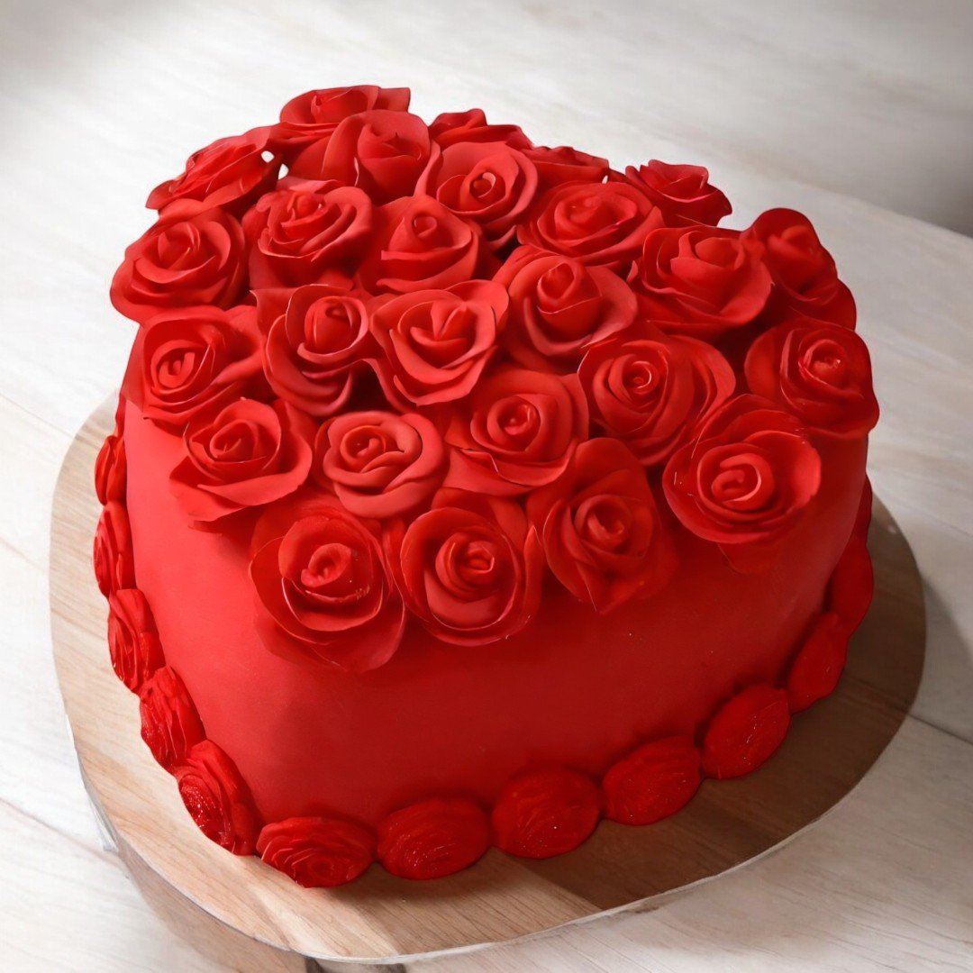 A beautifully crafted heart-shaped red velvet cake adorned with fondant roses from BetterGiftFlowers.