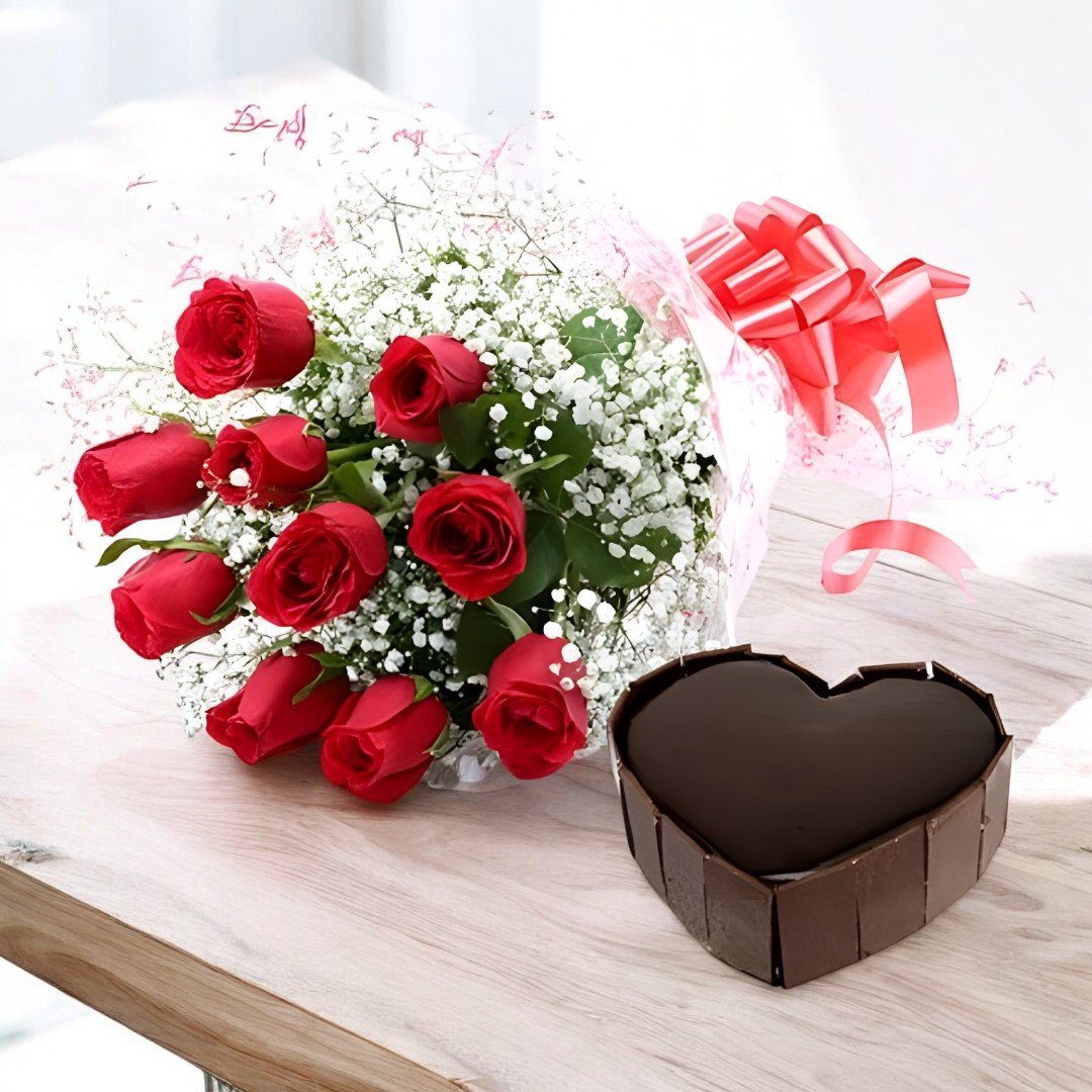 A stunning bouquet of 10 red roses with baby's breath and a heart-shaped chocolate cake from BetterGiftFlowers.