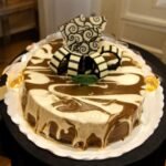 Dark chocolate and white swirled mousee cake by BetterGiftFlowers, topped with elegant chocolate decorations.