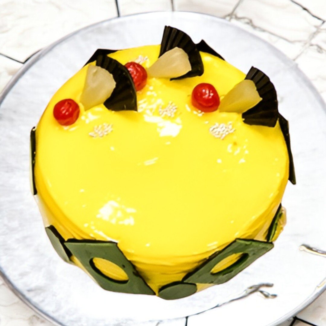 Top view of BetterGiftFlowers' Pineapple Cake with cherries and pineapple pieces.