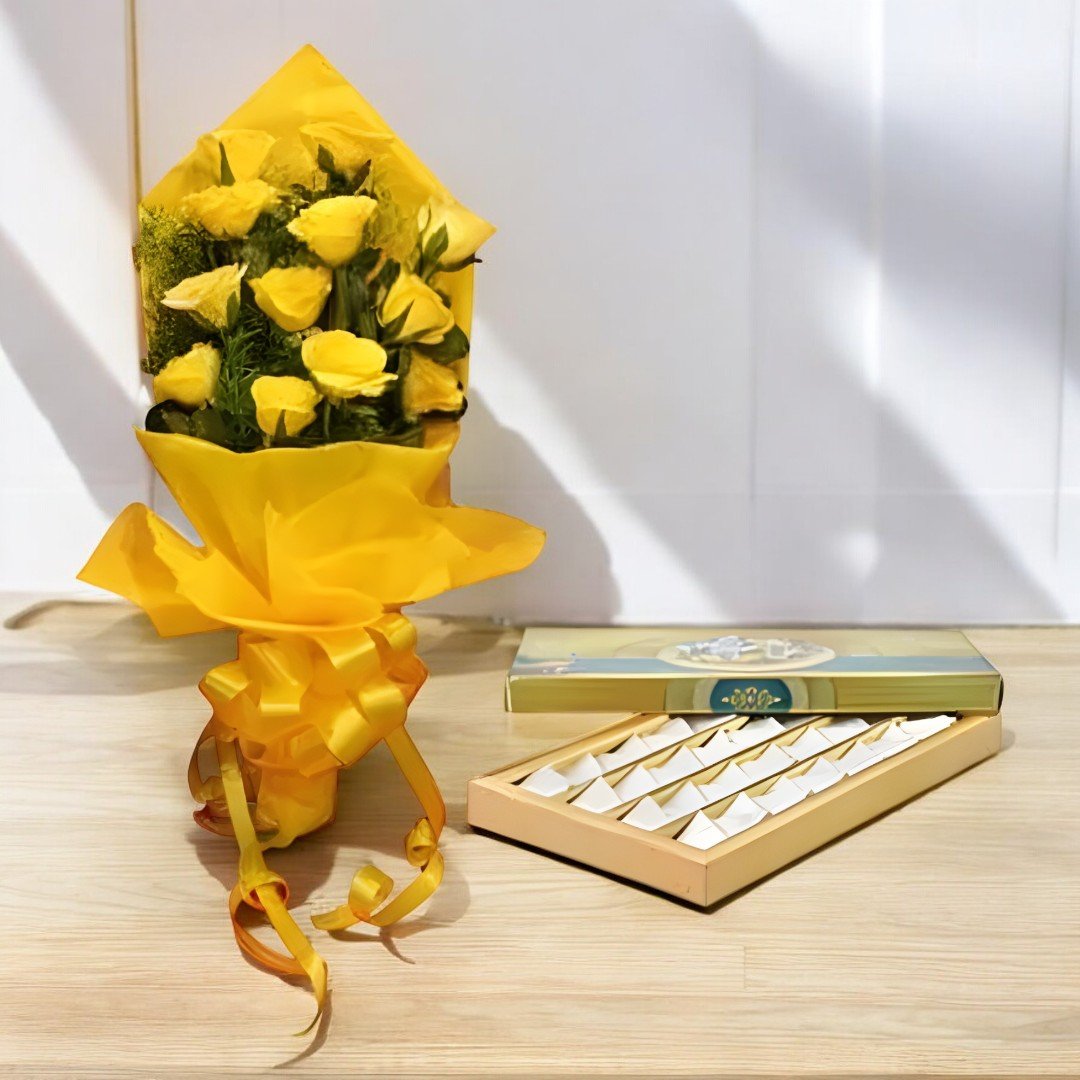 A beautiful bouquet of yellow roses with Kaju Katli from BetterGiftFlowers.