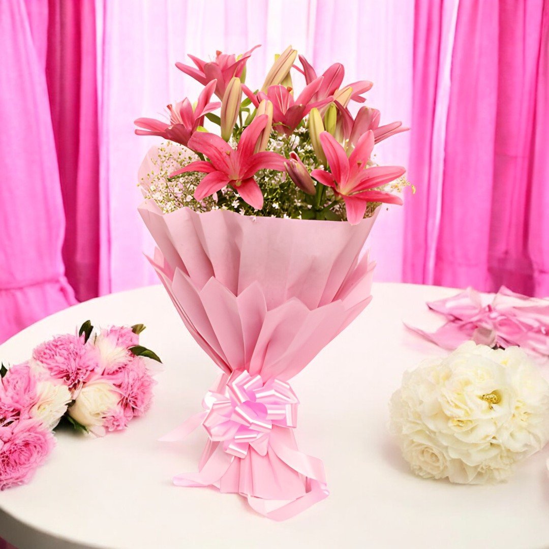 Simply Lily bouquet by Better Gift Flowers with pink lilies wrapped in pink paper.