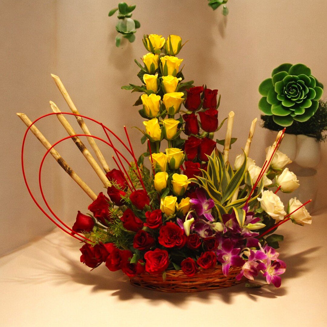 Stylish & Sophisticated flower basket arrangement of roses and orchids by BetterGiftFlowers.