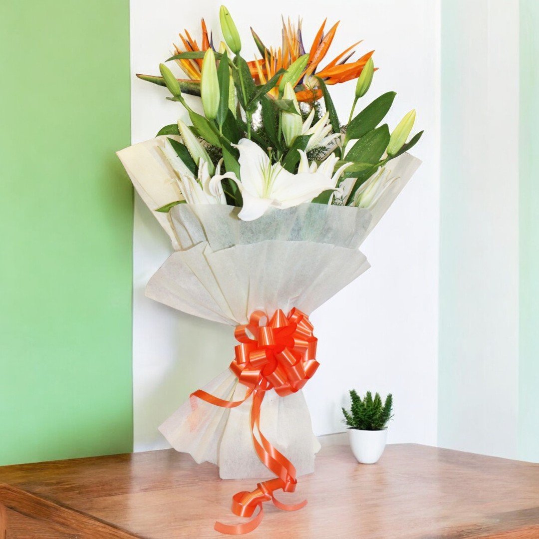 Image of "Summer Surprise" bouquet with 3 lilies and 2 Birds of Paradise, expertly crafted by BetterGiftFlowers.