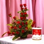 Sweet Surprise red rose arrangement with Haldiram's Rasgulla by BetterGiftFlowers.