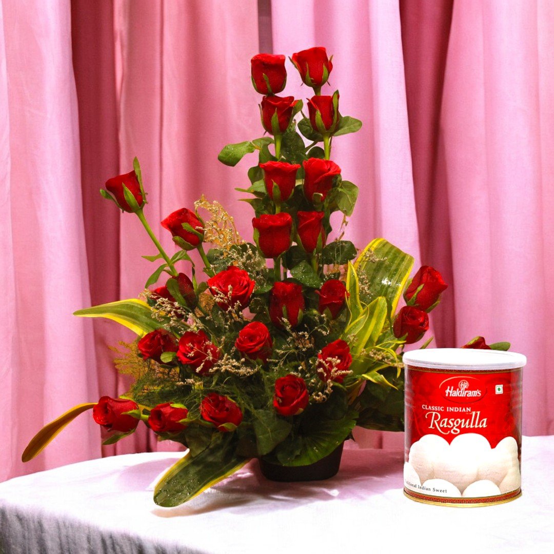 Sweet Surprise red rose arrangement with Haldiram's Rasgulla by BetterGiftFlowers.