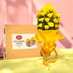 Bouquet of yellow roses with Haldiram's Motichoor Ladoo by Better Gift Flowers for festive gifting.