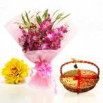 Orchids and dry fruits basket gift set by BetterGiftFlowers with a pink orchid bouquet and premium dry fruits in a traditional basket.