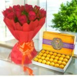 BetterGiftFlowers fresh red roses bouquet and traditional besan ladoo box combo - perfect festive gift.