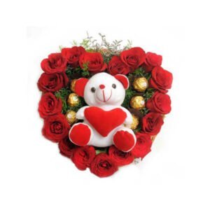 heart shape flower arrangement with teddy and ferrero