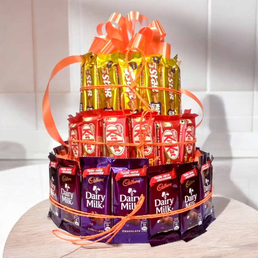 Pile of chocolates with Cadbury Dairy Milk, KitKat, and 5 Star arranged in a tower by Better Gift Flowers.