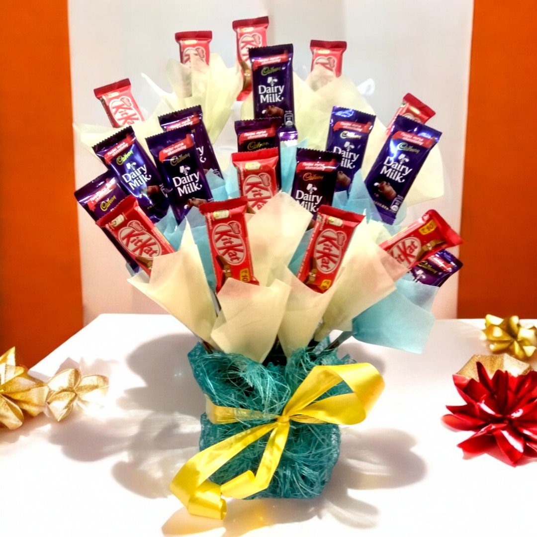 BetterGiftFlowers Tempting Choco Hamper with KitKat and Dairy Milk chocolates beautifully arranged.