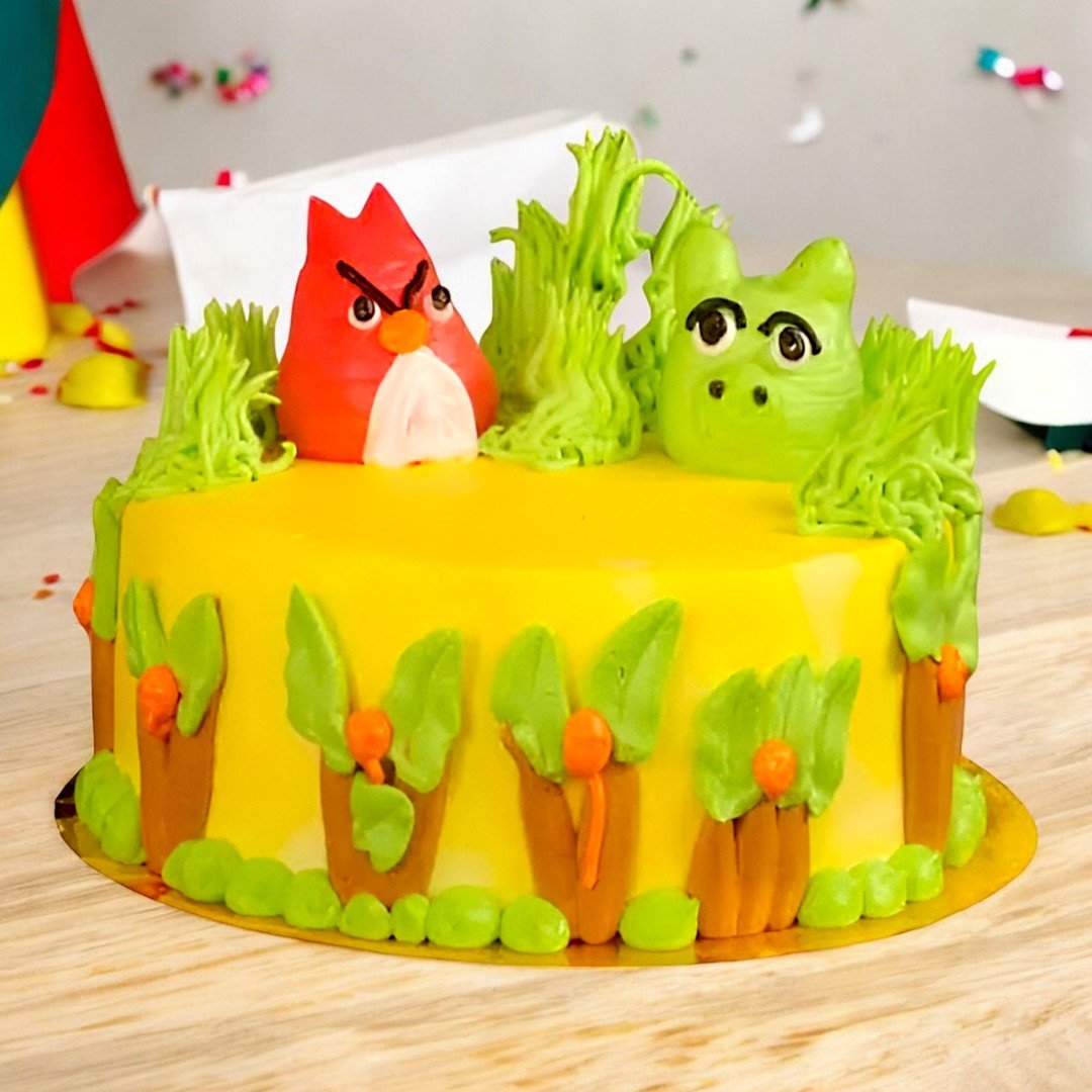 Angry Bird-themed cake with edible decorations of red and green characters, available at BetterGiftFlowers