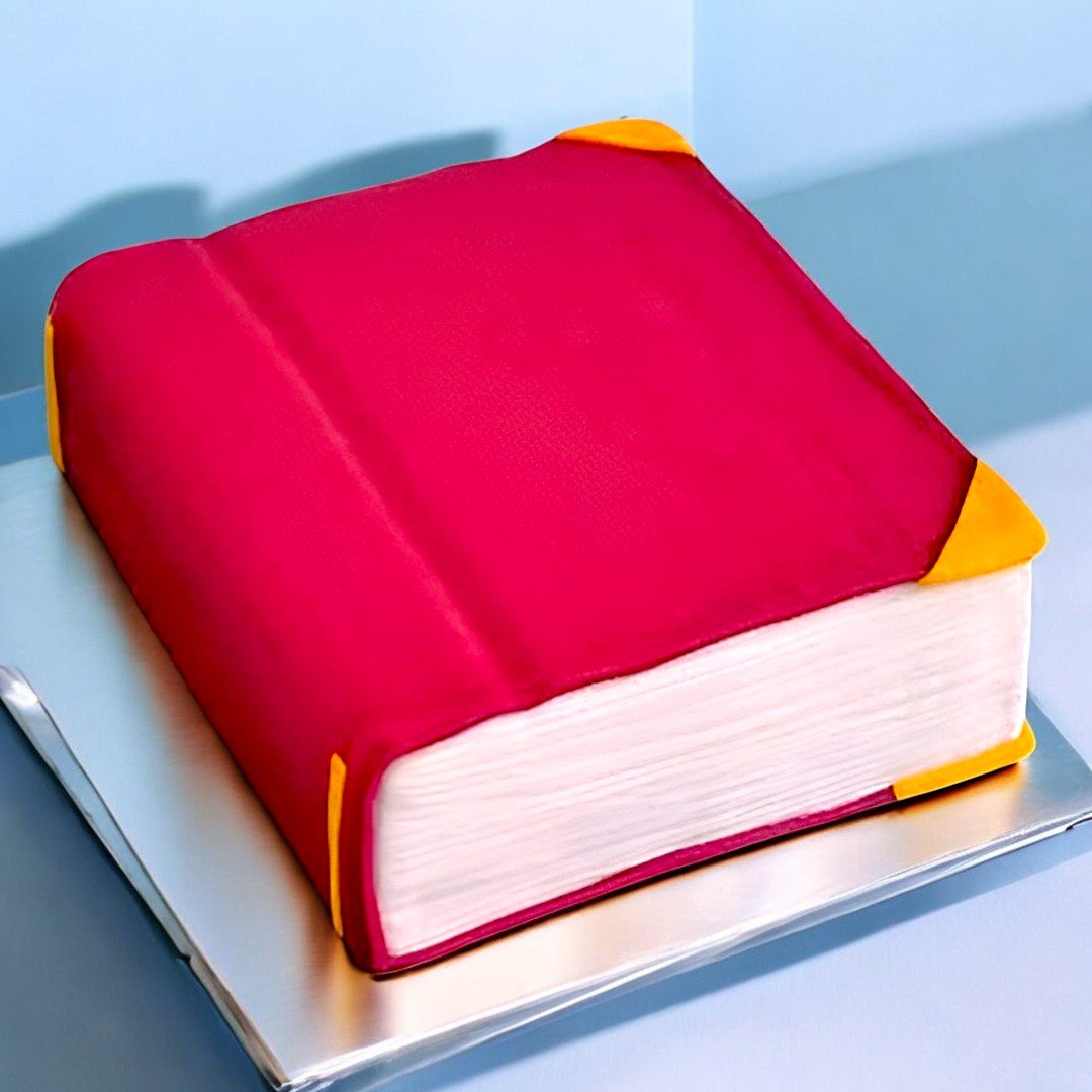 A realistic book-shaped cake with a red cover from Better Gift Flowers, ideal for readers and book lovers.